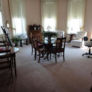 A cozy living room with elegant furniture and abundant natural light.