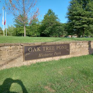 Welcome to Oak Tree Pond Historic Park, a serene spot surrounded by nature.