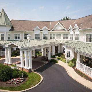 A beautiful residential building with a welcoming entrance and well-maintained landscaping.