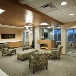 A modern office waiting area featuring comfortable seating and an inviting atmosphere.