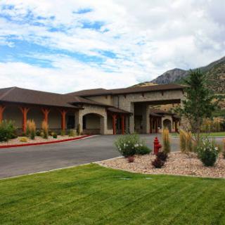 A beautiful exterior view of a modern building set against a mountainous backdrop.