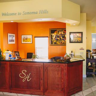 A welcoming reception area with a neatly arranged desk and vibrant decor.