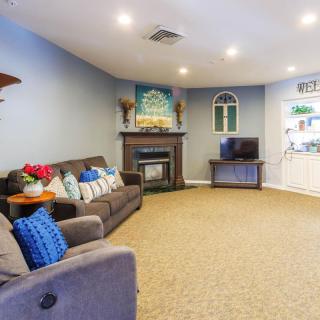 Cozy living room with a fireplace and comfortable seating.