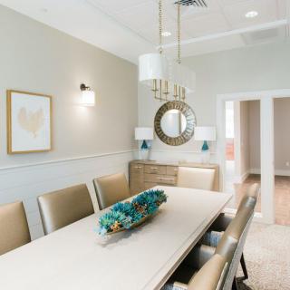 A modern dining room with elegant furniture and stylish decor.