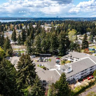 A scenic aerial view of a residential area surrounded by trees and nature.