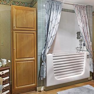 A cozy bathroom with a bathtub, cabinets, and decorative curtains.