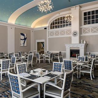 Elegant dining area with a decorative ceiling and chandelier.