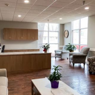 A modern and welcoming waiting room with comfortable seating and natural light.
