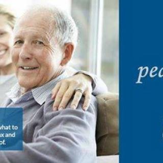 An elderly couple smiling and enjoying time together indoors.
