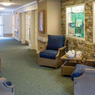 A cozy hallway with comfortable seating and decorative elements.