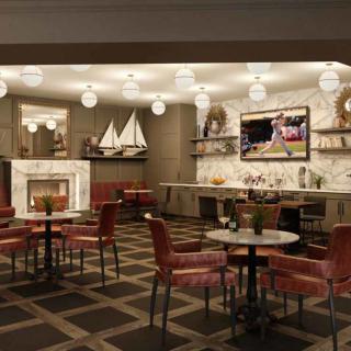 A stylish restaurant interior with cozy seating, a fireplace, and nautical-themed decor.