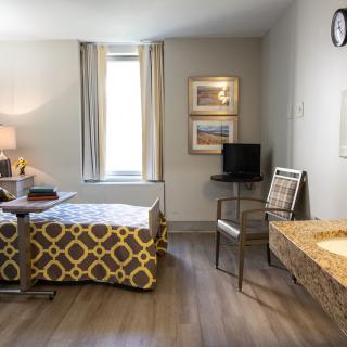 A cozy and well-lit room with modern furniture and decorations.