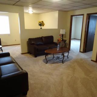 A cozy living room with comfortable seating and a coffee table.