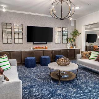 A modern living room with stylish decor and comfortable seating.