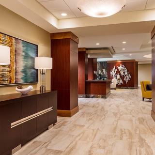 A modern hotel lobby with elegant decor and contemporary artwork.