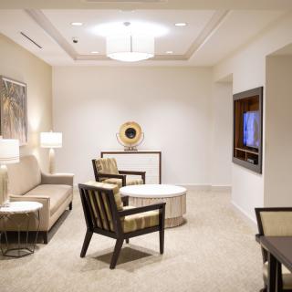 A modern living room with stylish furniture and elegant lighting.