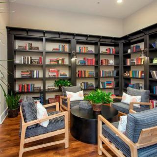 Cozy reading nook with bookshelves and comfortable seating.
