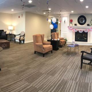 A cozy living room with comfortable seating and festive decorations.