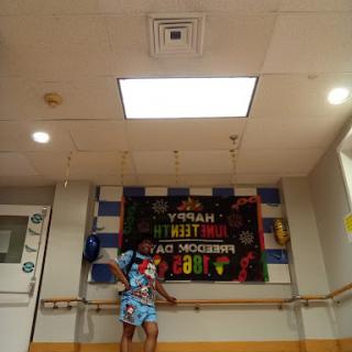 A vibrant dance studio celebrating 'National Dance Day' with colorful decorations and joyful energy.