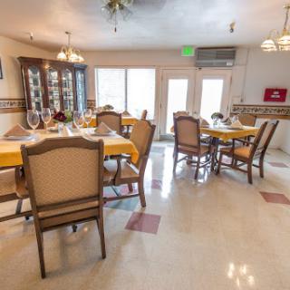 A spacious and well-lit dining area, designed for comfort and social gatherings.