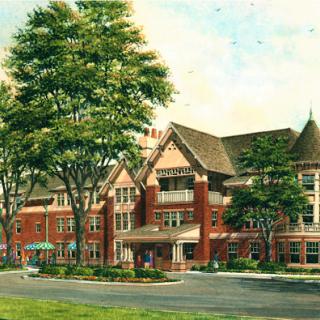 A beautifully detailed historic hotel building surrounded by lush greenery.