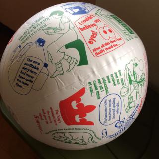 A beach ball displaying colorful exercise instructions and illustrations.
