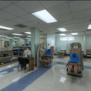An empty hospital room equipped with dialysis machines.