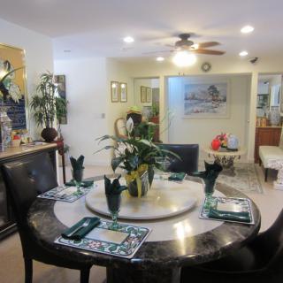 A cozy dining room with a well-set table and elegant decor.