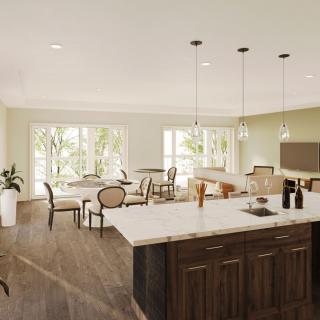 A spacious open floor plan kitchen and dining area with modern design elements and ample natural light.