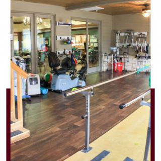 A rehabilitation center equipped with various therapy tools and parallel bars for physical therapy exercises.