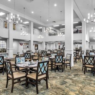 Spacious dining area with elegant decor and ample seating arrangements.
