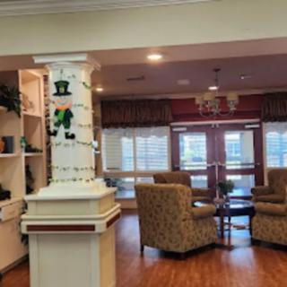 A welcoming lobby area featuring comfortable seating and festive holiday decorations.
