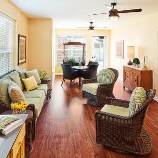 A cozy living room with comfortable seating, warm lighting, and stylish decor.