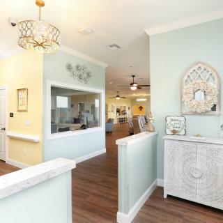 A modern and elegantly decorated living area with light pastel walls and stylish furnishings.
