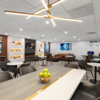 A modern office lounge designed for collaboration and relaxation, featuring stylish furniture and a welcoming atmosphere.