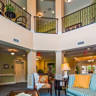 A spacious and elegantly decorated lobby with comfortable seating and ambient lighting.