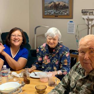 A group of people enjoying a meal together indoors.
