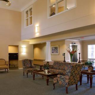 A spacious lobby area with comfortable seating and elegant decor.