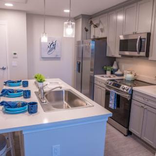 A stylish modern kitchen featuring sleek cabinetry and contemporary appliances.
