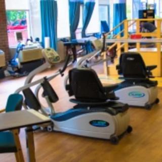 A gym filled with various cardio exercise machines.