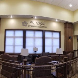 A cozy lobby space featuring comfortable seating and natural light.
