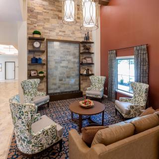 A cozy living room with comfortable seating and elegant decor.