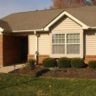 A single-story suburban house with brick and siding exterior.