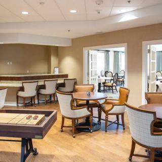 A cozy lounge area with tables and chairs arranged for relaxation.