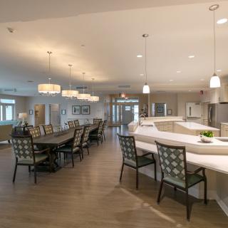 A modern dining area with elegant lighting and seating.