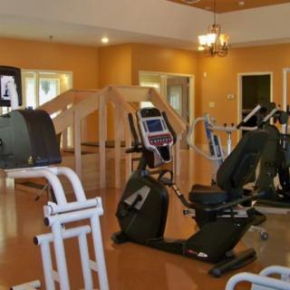 A well-equipped gym with various exercise machines.