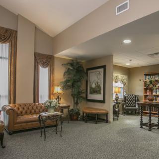 A cozy living room with comfortable seating, soft lighting, and elegant decor.