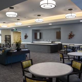 A modern lounge with comfortable seating and stylish lighting fixtures.