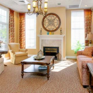 A cozy living room with elegant furniture and a fireplace.