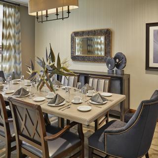 Elegant dining room with a beautifully set table and modern decor.